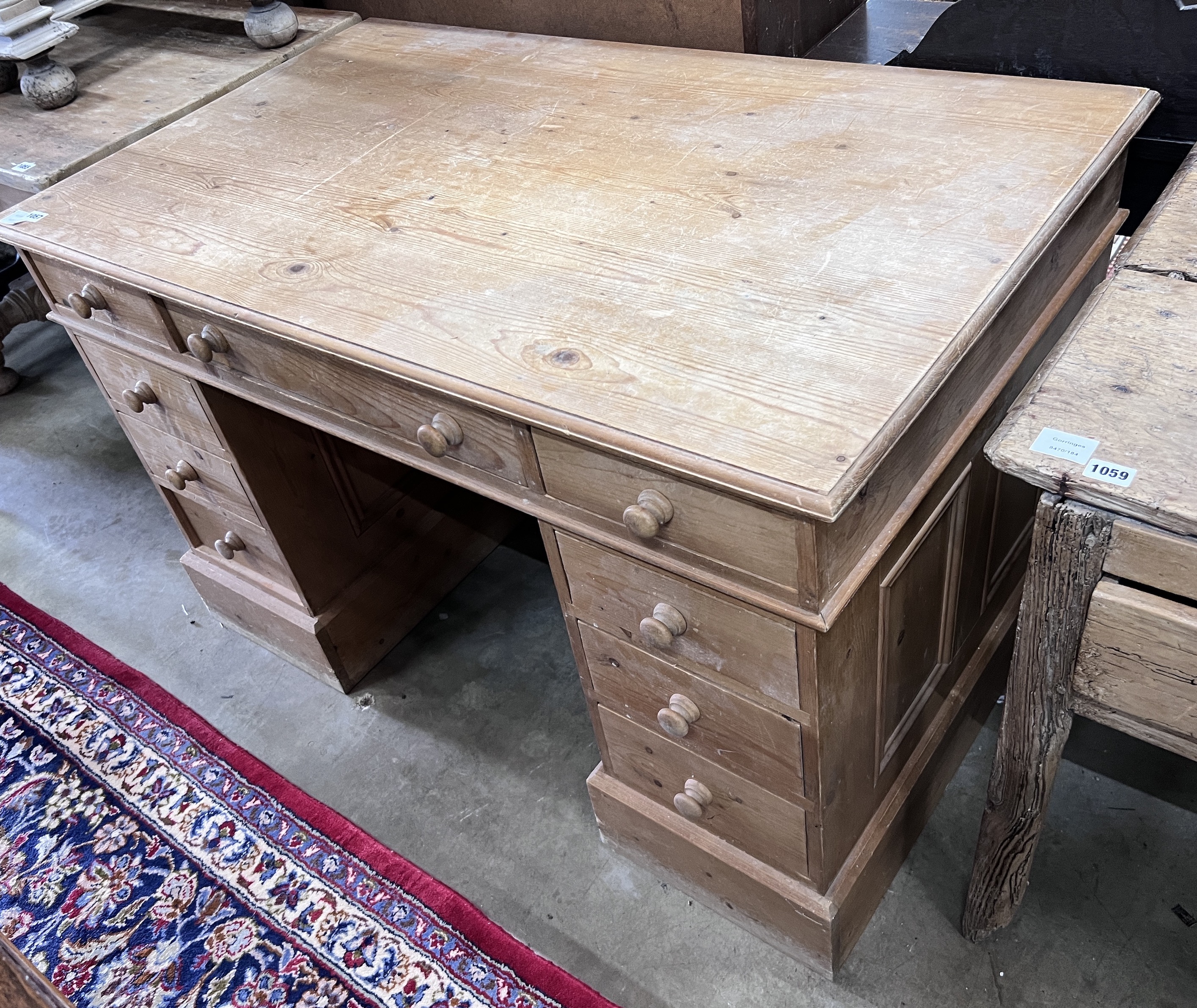 A modern Victorian style pine pedestal desk, width 120cm, depth 72cm, height 76cm